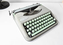 Load image into Gallery viewer, 1957 Portable Seafoam Hermes Baby Typewriter
