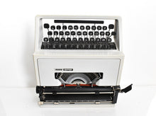 Load image into Gallery viewer, Olivetti Dora, UNCOMMON Techno cubic typeface
